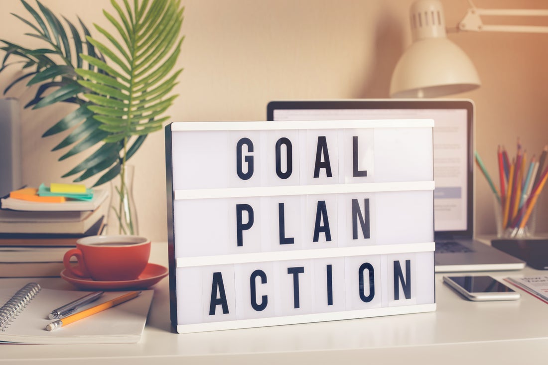 a sign reading goal, plan, action.